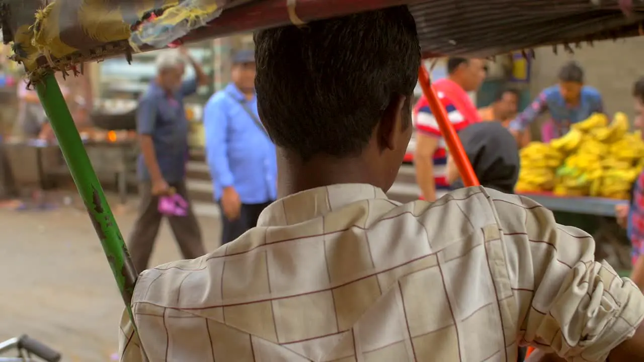 Close-Up of a Man Sitting in a Rickshaw