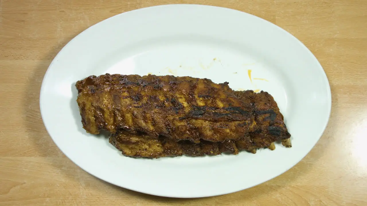 Top Steady Shot Of Grilled Pork BBQ Ribs Steak With Side Dish