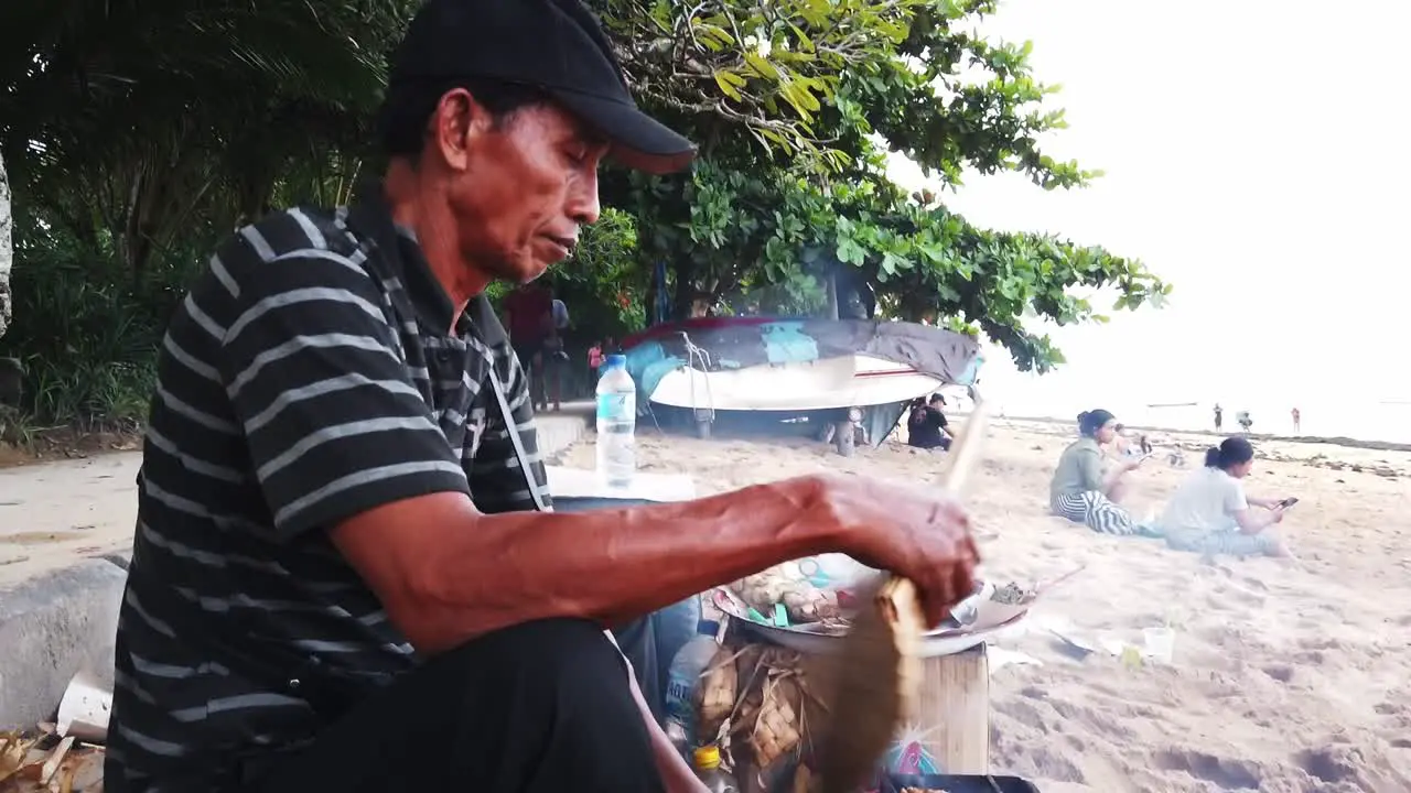 Seller Grills Meat Brochette at Sanur Beach Sate Traditional Indonesian Food Local Asian Typical Dish Cusine in Bali Southeast Asia