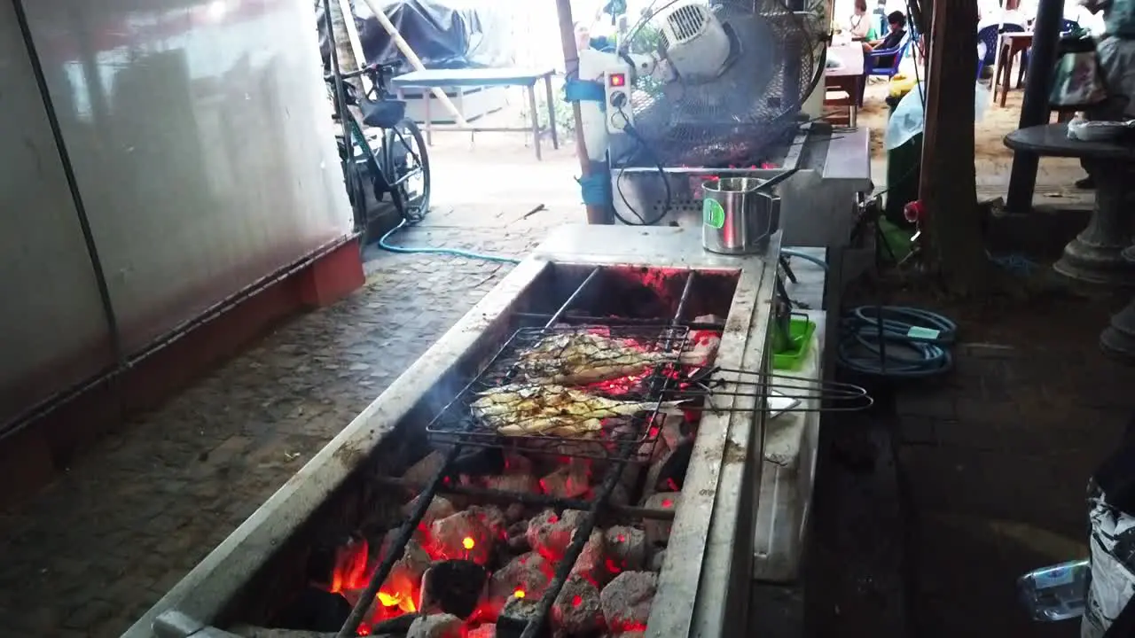 Grilling Fish Traditional Indonesian Food Market Beach in Sanur Bali Fire of the Coals on the Hot Meat between Tongs Pasar Sindhu