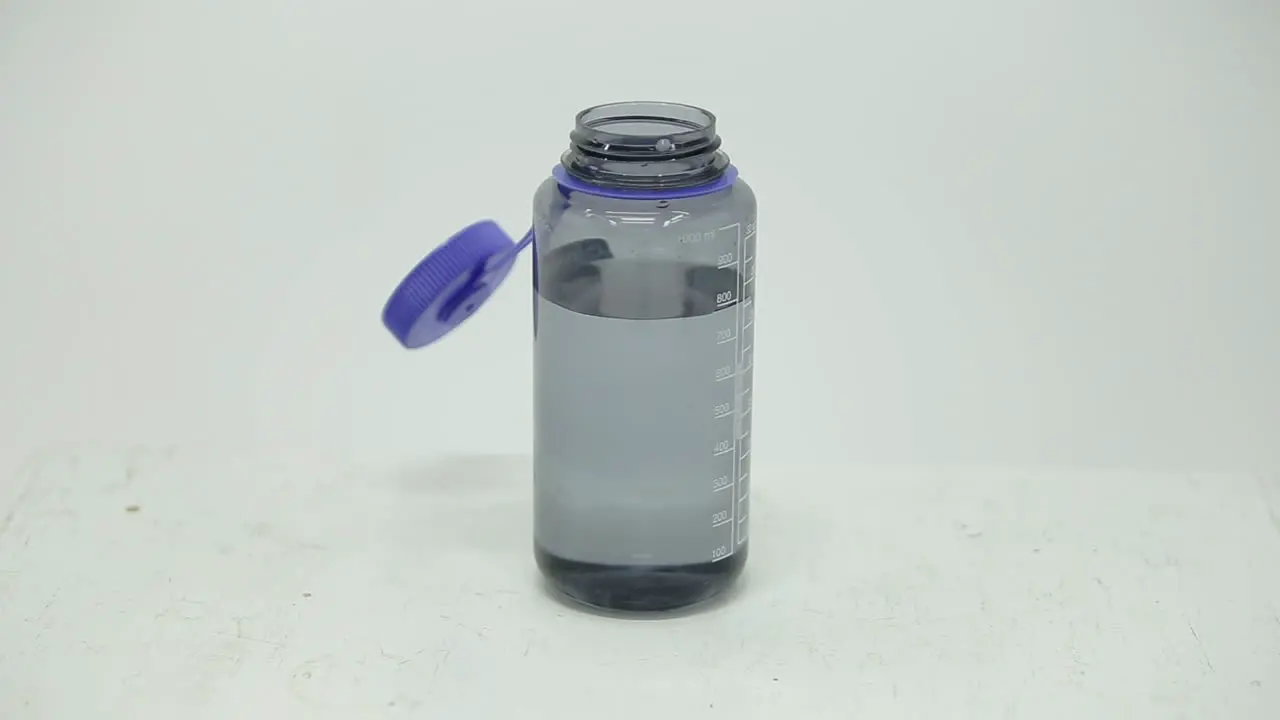 Dropping a dry ice cube into a water bottle