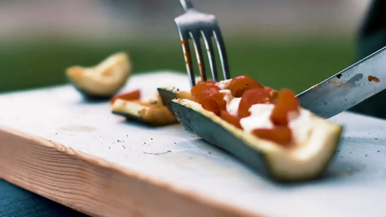 Cutting up a delicious vegan snack from the grill