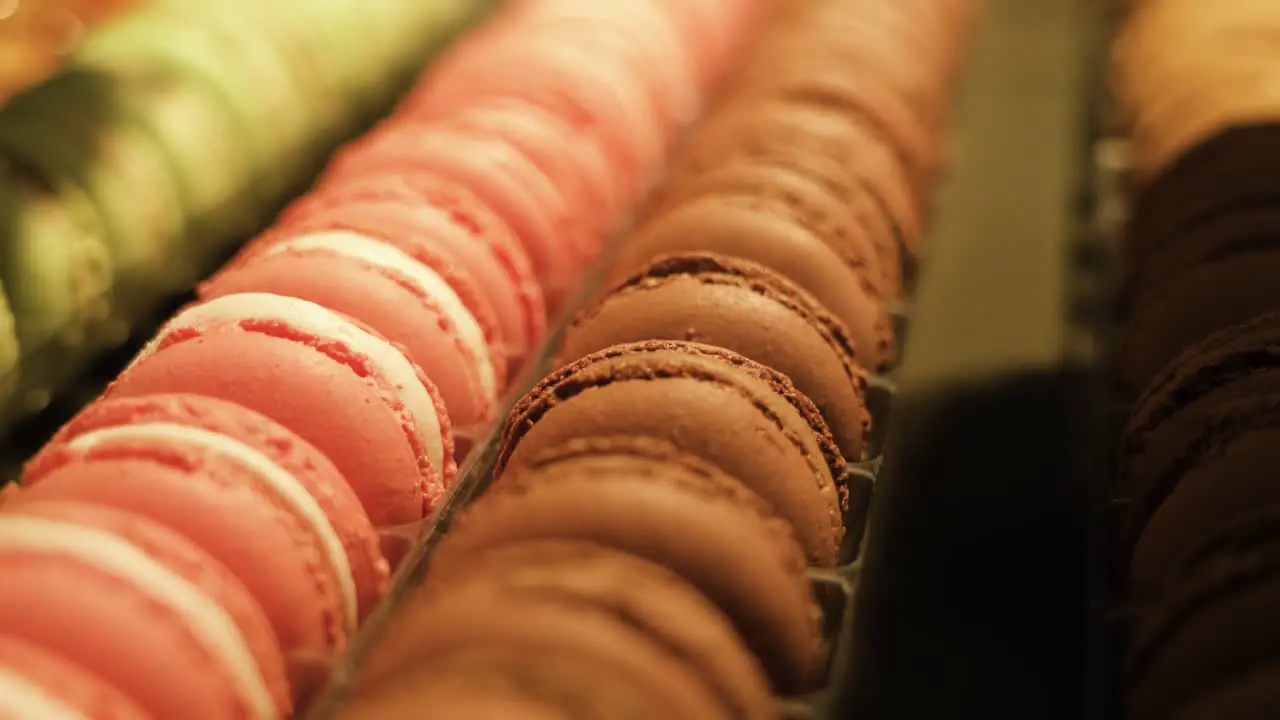 Colorful macaron biscuits color being made by adding a heaped tablespoon of gel paste color to the sugar syrup before cooking it food and cookies preparation concept