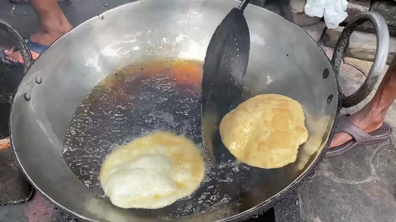 Chole Bhature Old Delhi Street Food fried in local roadside shop in India