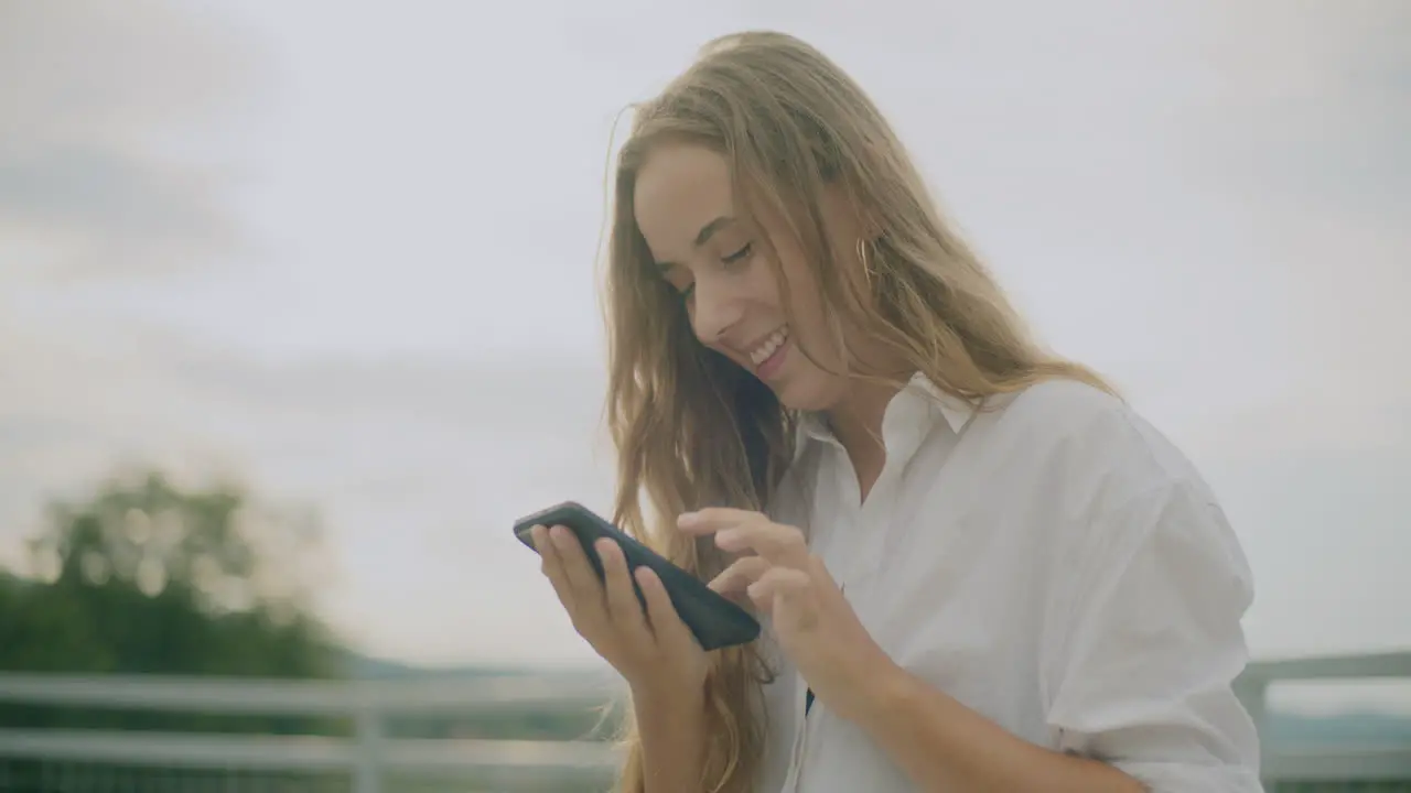 Smiling Woman Texting Smartphone