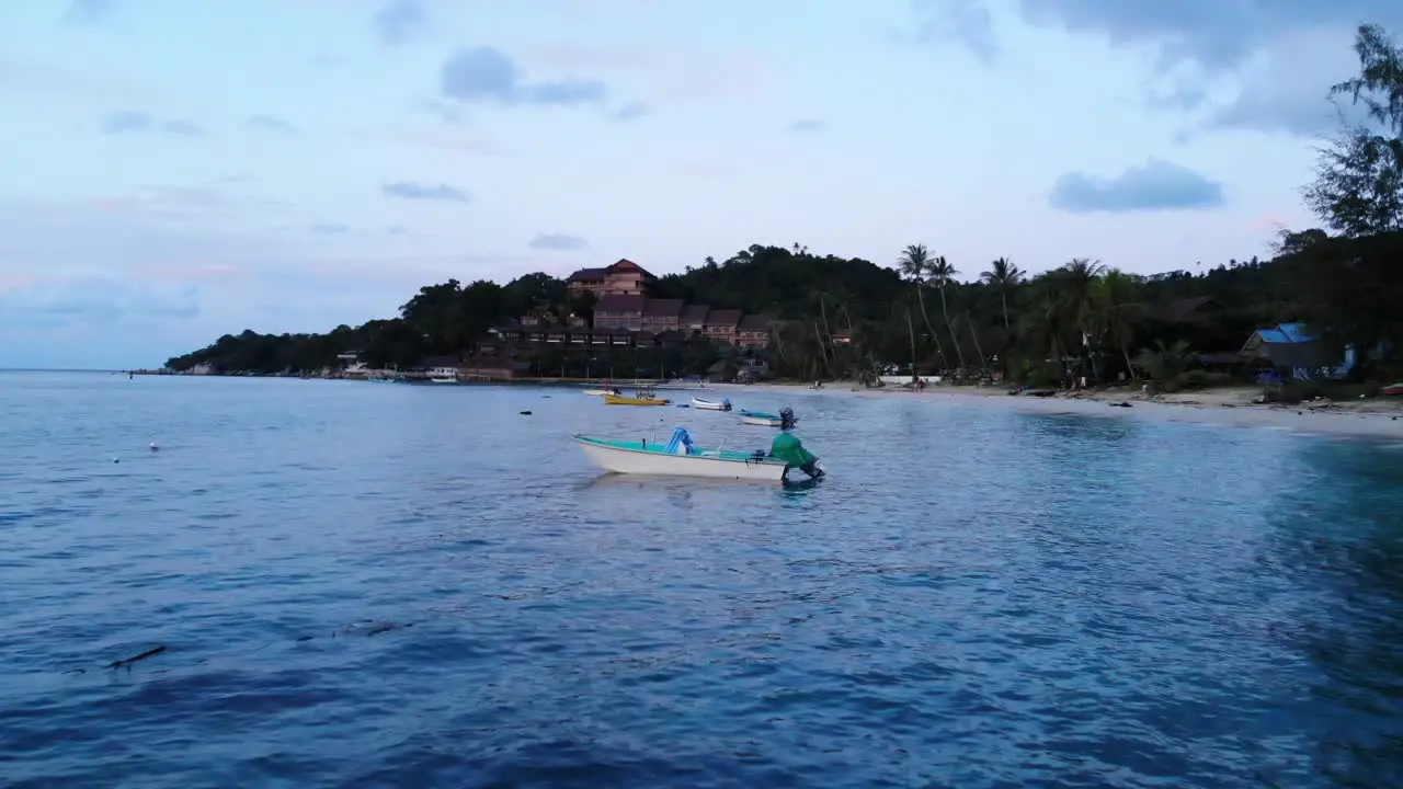 Boats Sway along the Beach during Sunset Blue Hour in Thailand Drone Shot