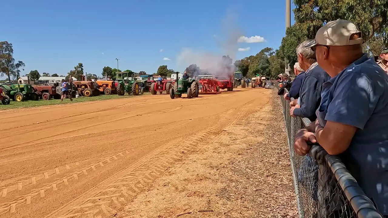 Yarrawonga Victoria Australia 7 October 2023 Old green tractor blowing smoke and working hard to pull the sled in a tractor pull at the Yarrawonga Show in Victoria Australia