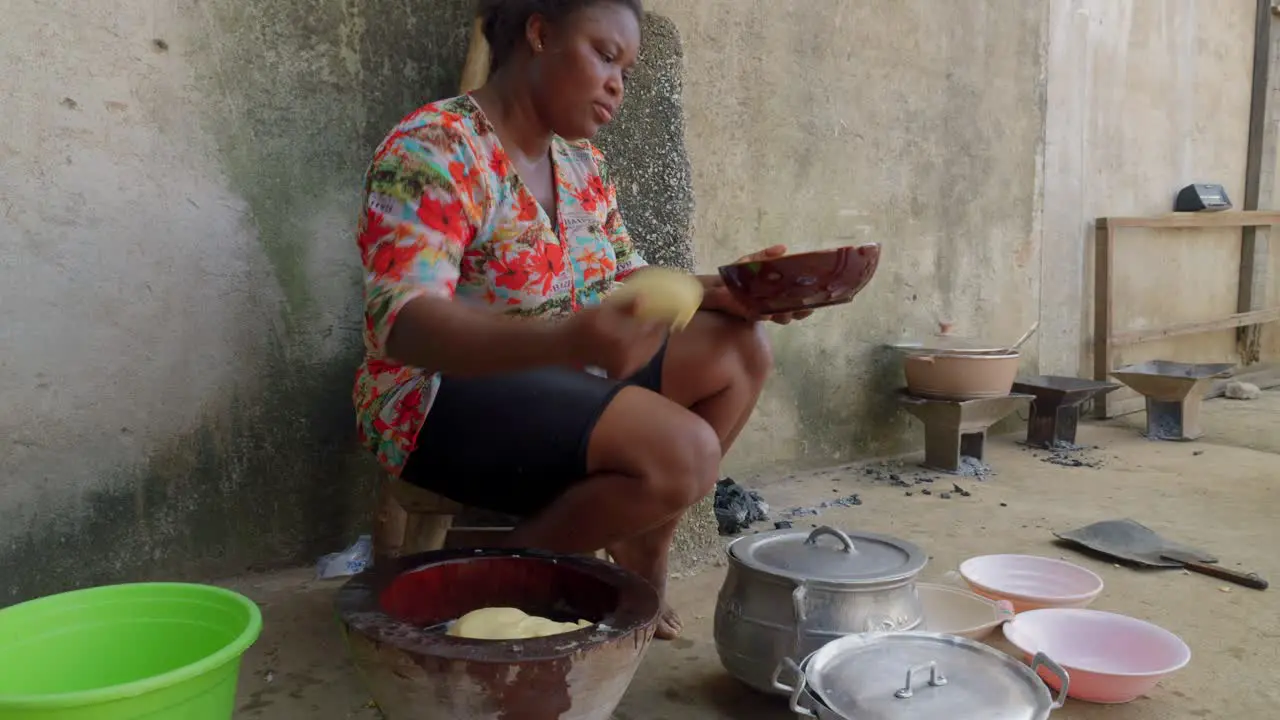 black African woman preparing fufu traditional street food in west africa expert skilled African chef