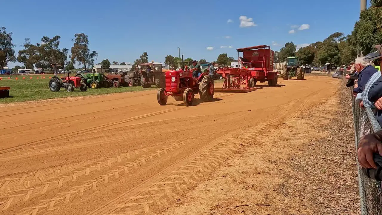 Yarrawonga Victoria Australia 7 October 2023 Red tractor using gentle turns as it pulls the sled along the tractor pull track at the Yarrawonga Show in Victoria Australia