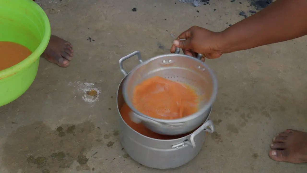 close up of black female African chef preparing Fufu a traditional meal from ghana