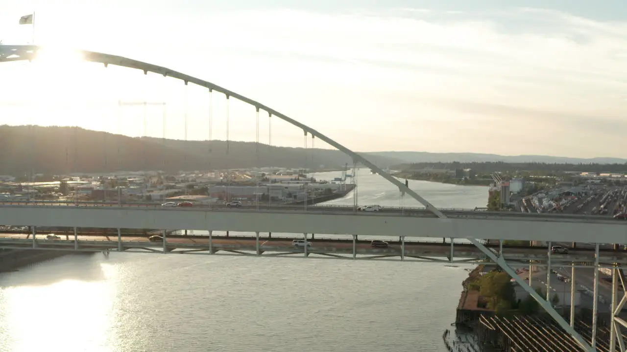 Dolly forward aerial shot towards double decker car bridge