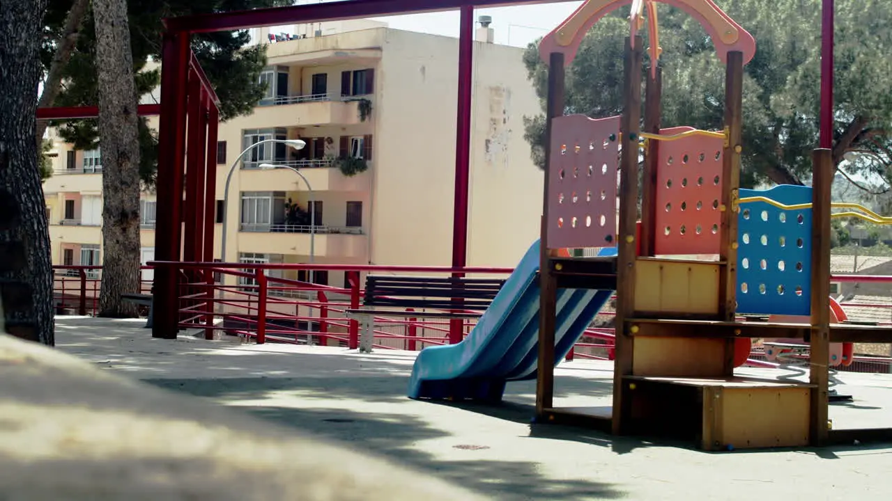 Empty playground between apartment buildings