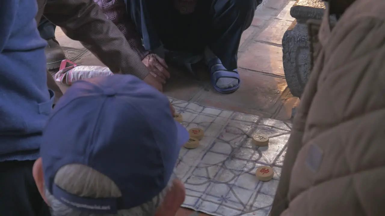 Playing board game on the street in Hanoi Vietnam