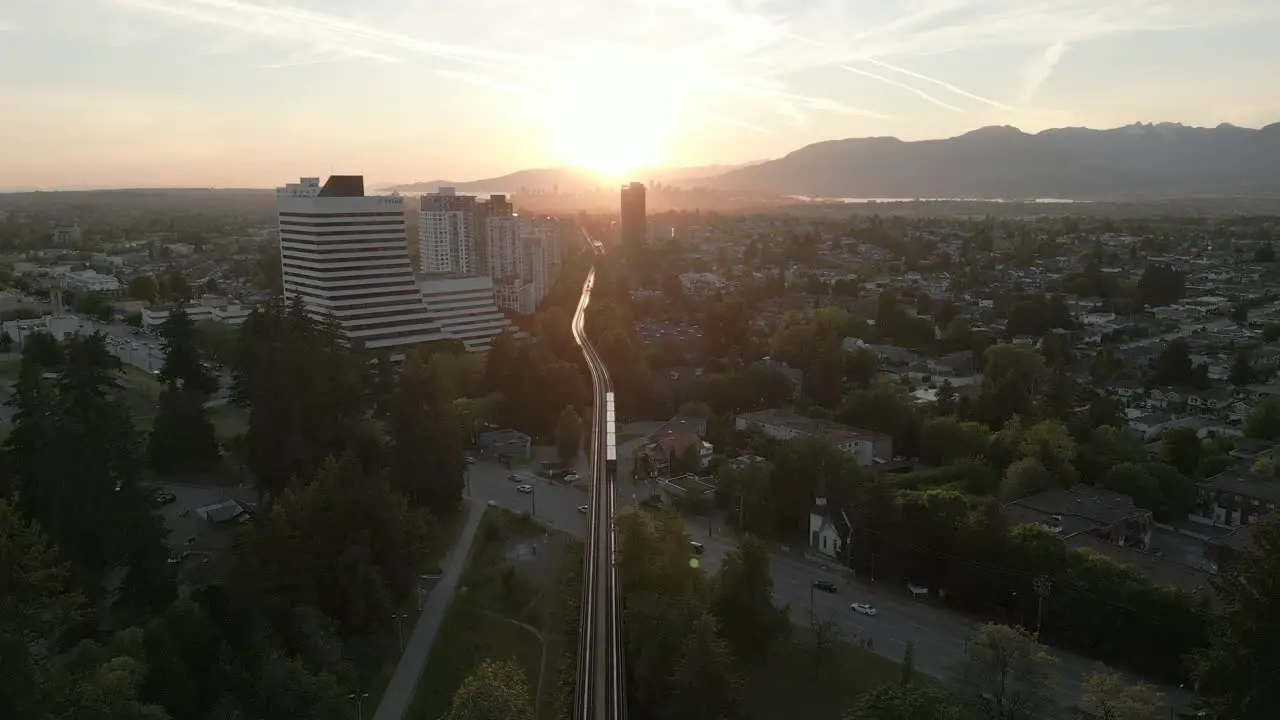 Public Transportation Sky train Heading Towards the Sunset in Downtown Vancouver Aerial