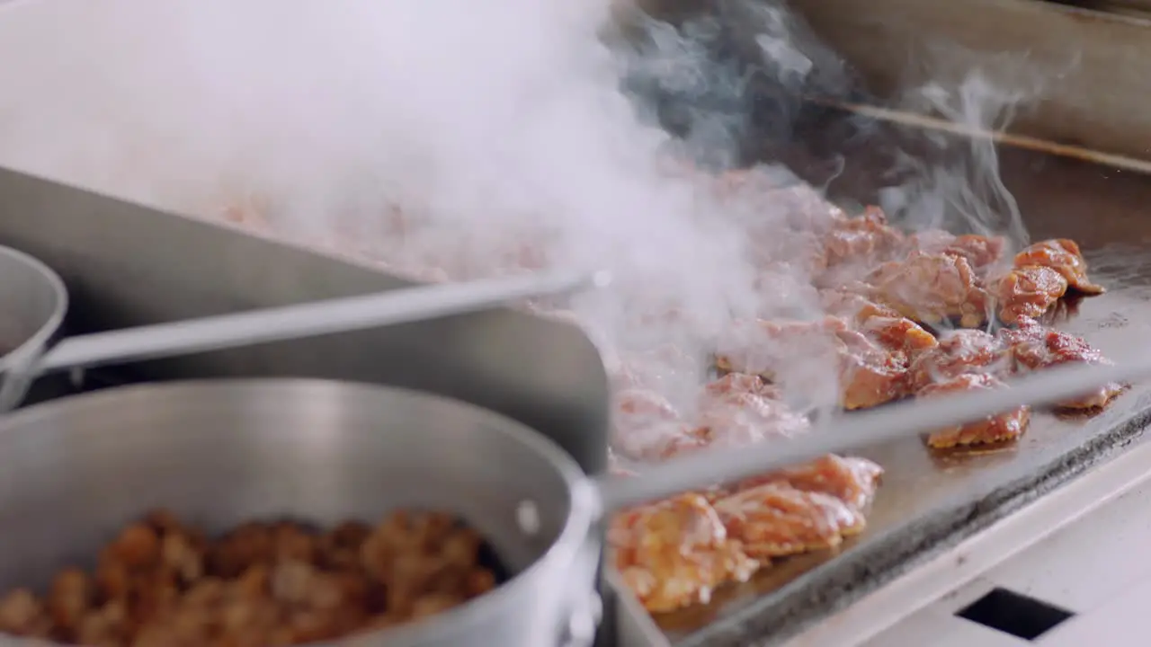 Steaming Food Cooking on Griddle in Daytime Kitchen