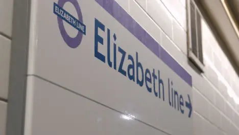 Close Up Of Direction Sign For New Elizabeth Line Tube Link In London UK