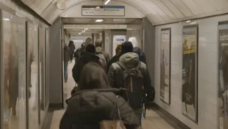 Commuter Passengers Making Their Way To Platforms In Underground Station At London Euston UK