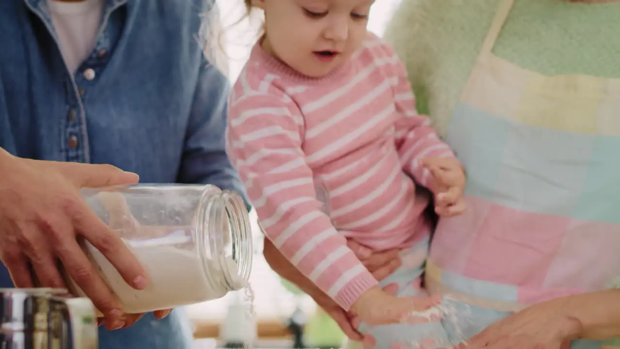 Handheld view of family baking cookies for Easter