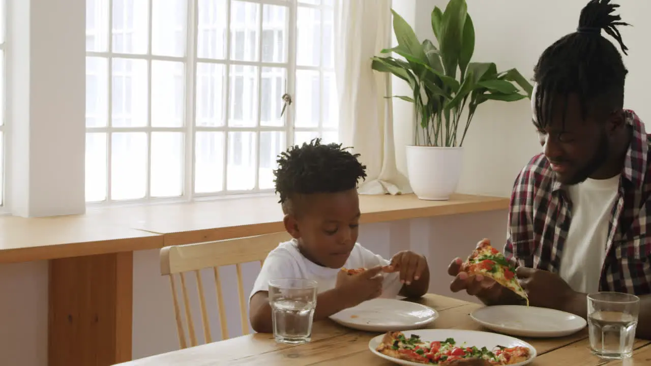 Father and son eating together