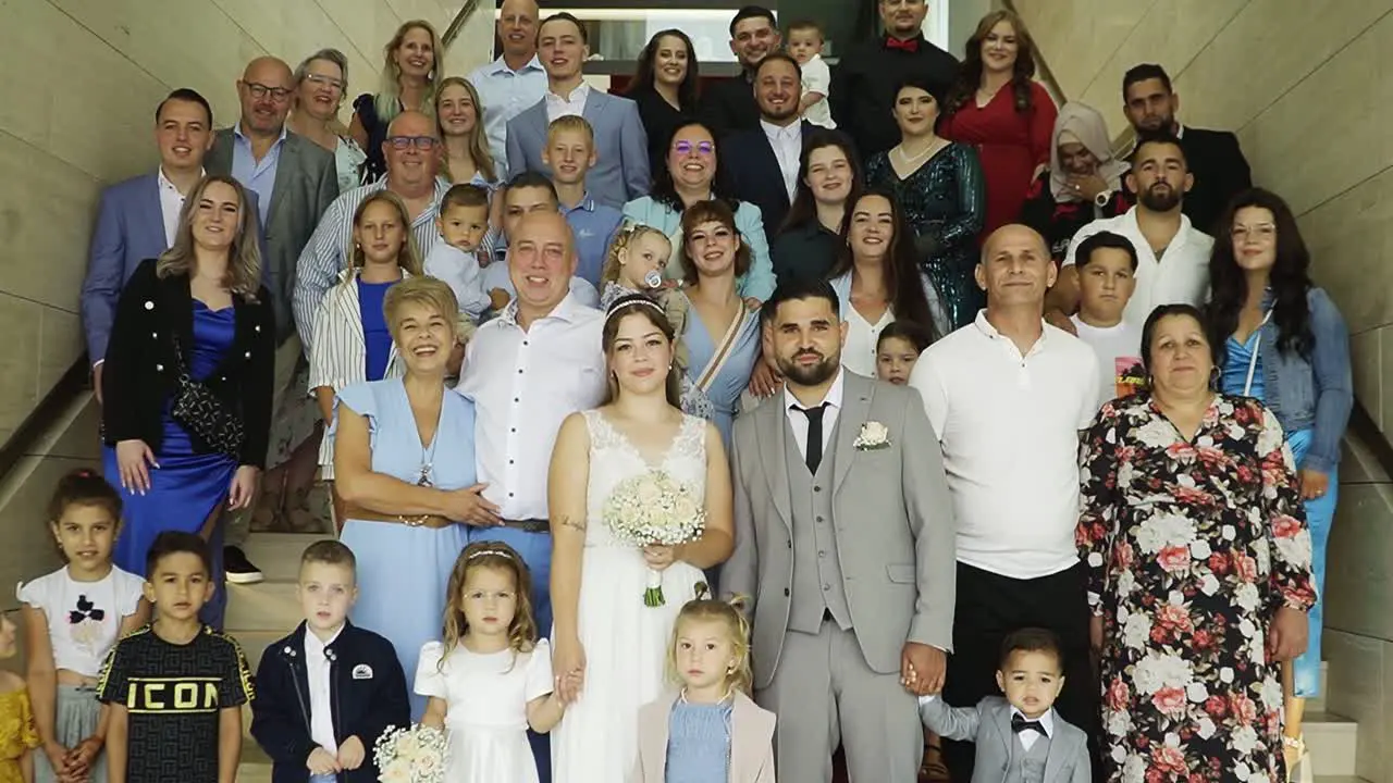 Family and friends portrait with bride and groom in the wedding ceremony