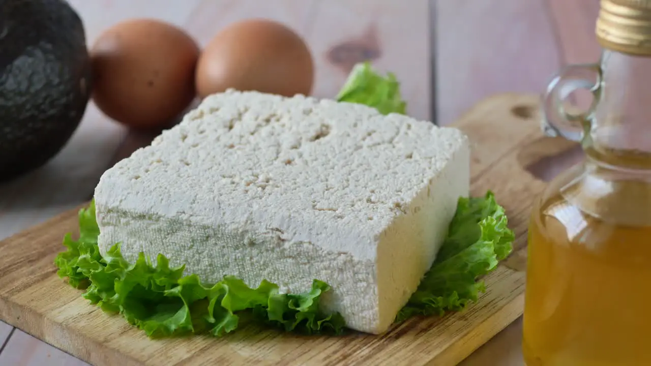 Slice of tofu egg and oil on table