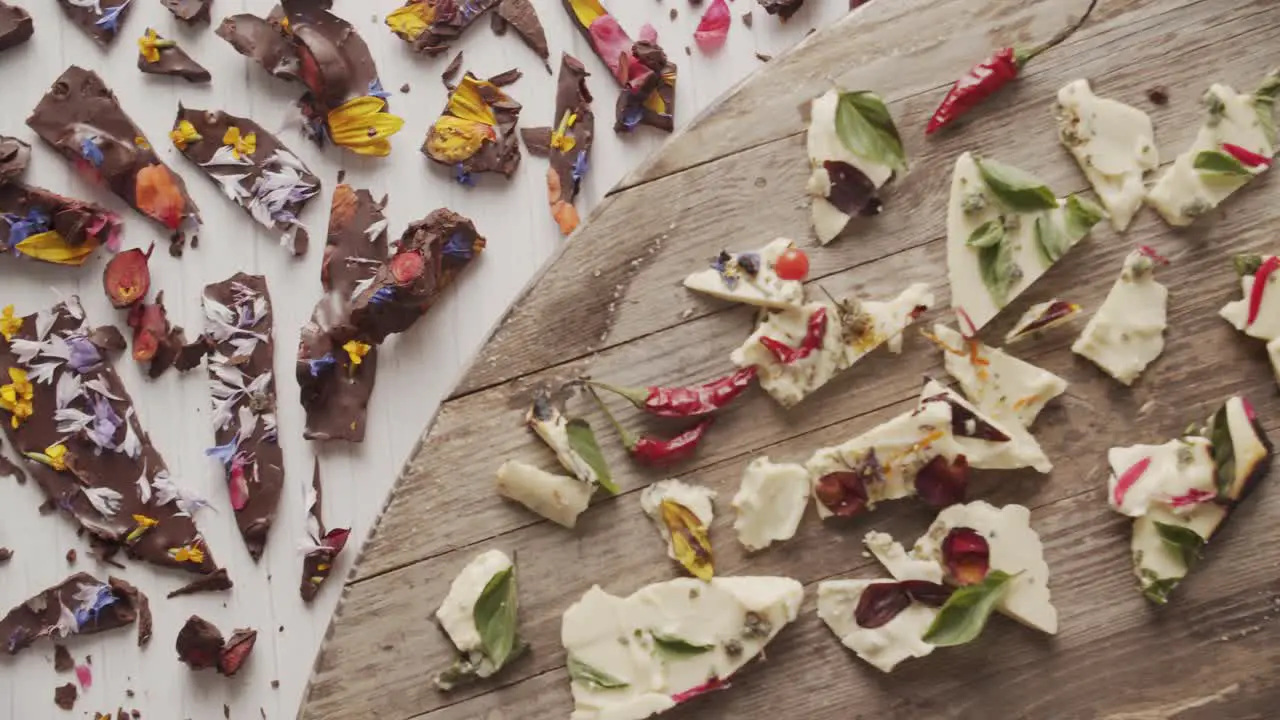 Top view of pieces of chocolate garnished with edible flowers