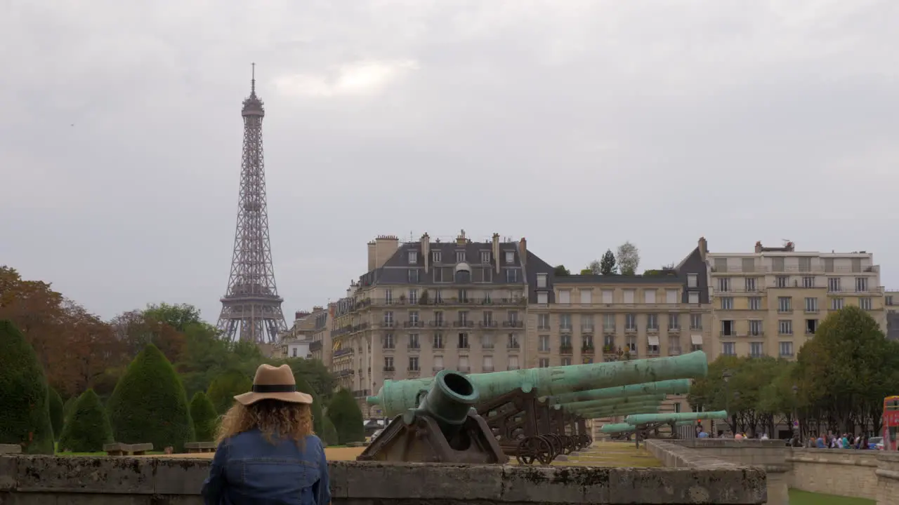 Paris view with Eiffel Tower and old cannons near Les Invalides France