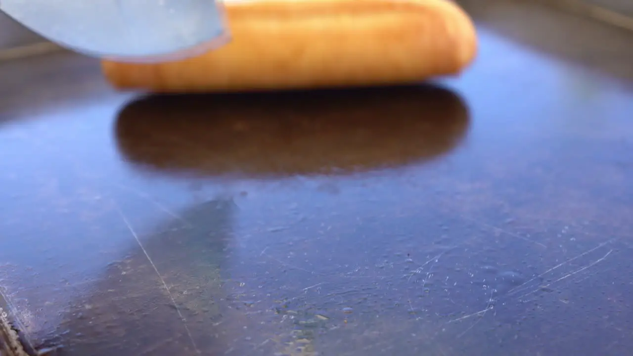 Roasting the bread on the grill close up