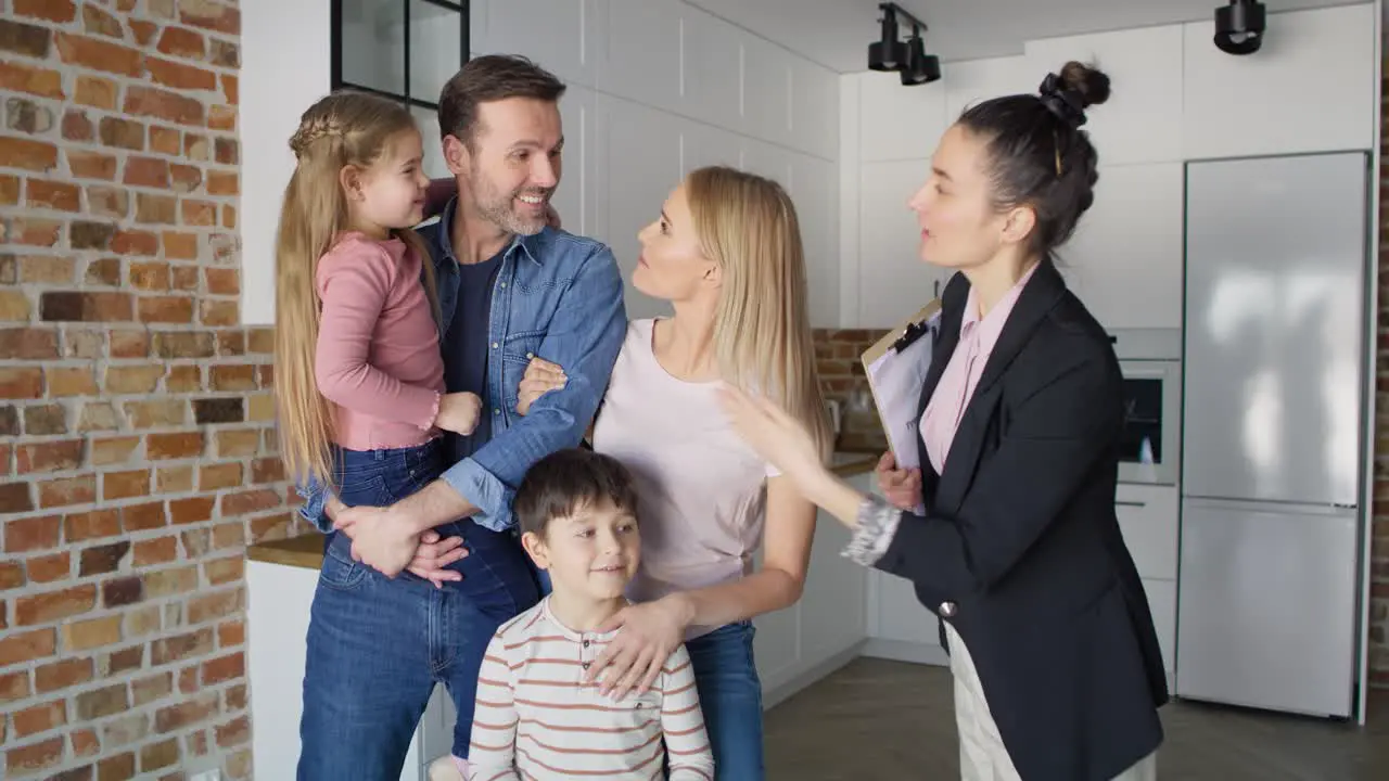 Video of estate agent showing the family a new apartment