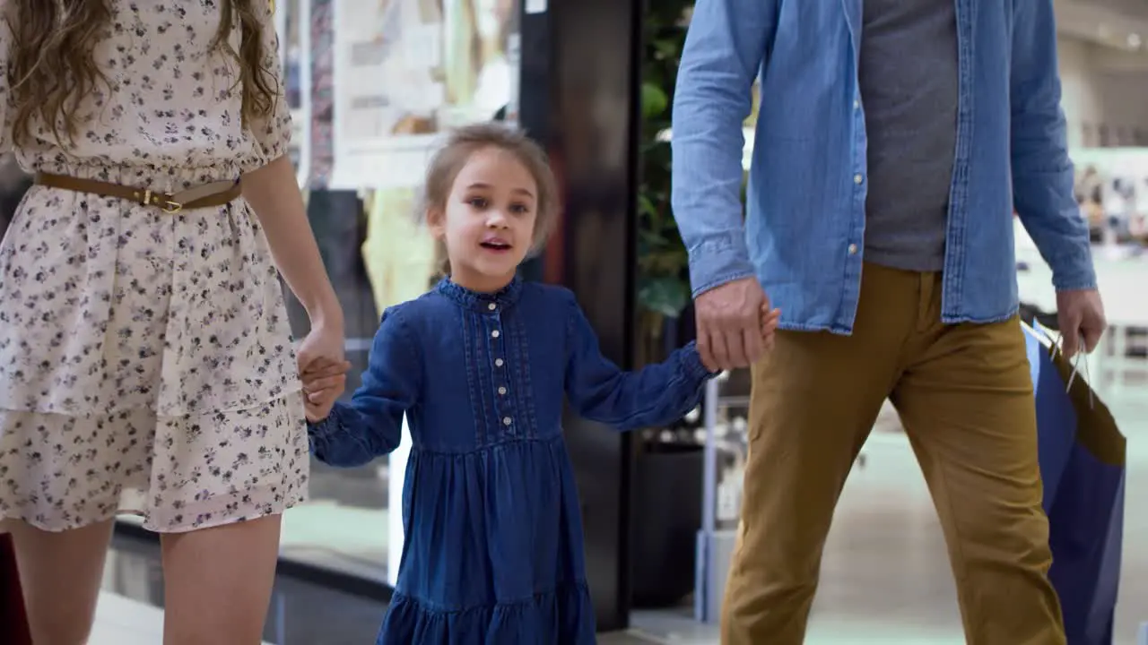 Video of little playful girl during shopping at the mall