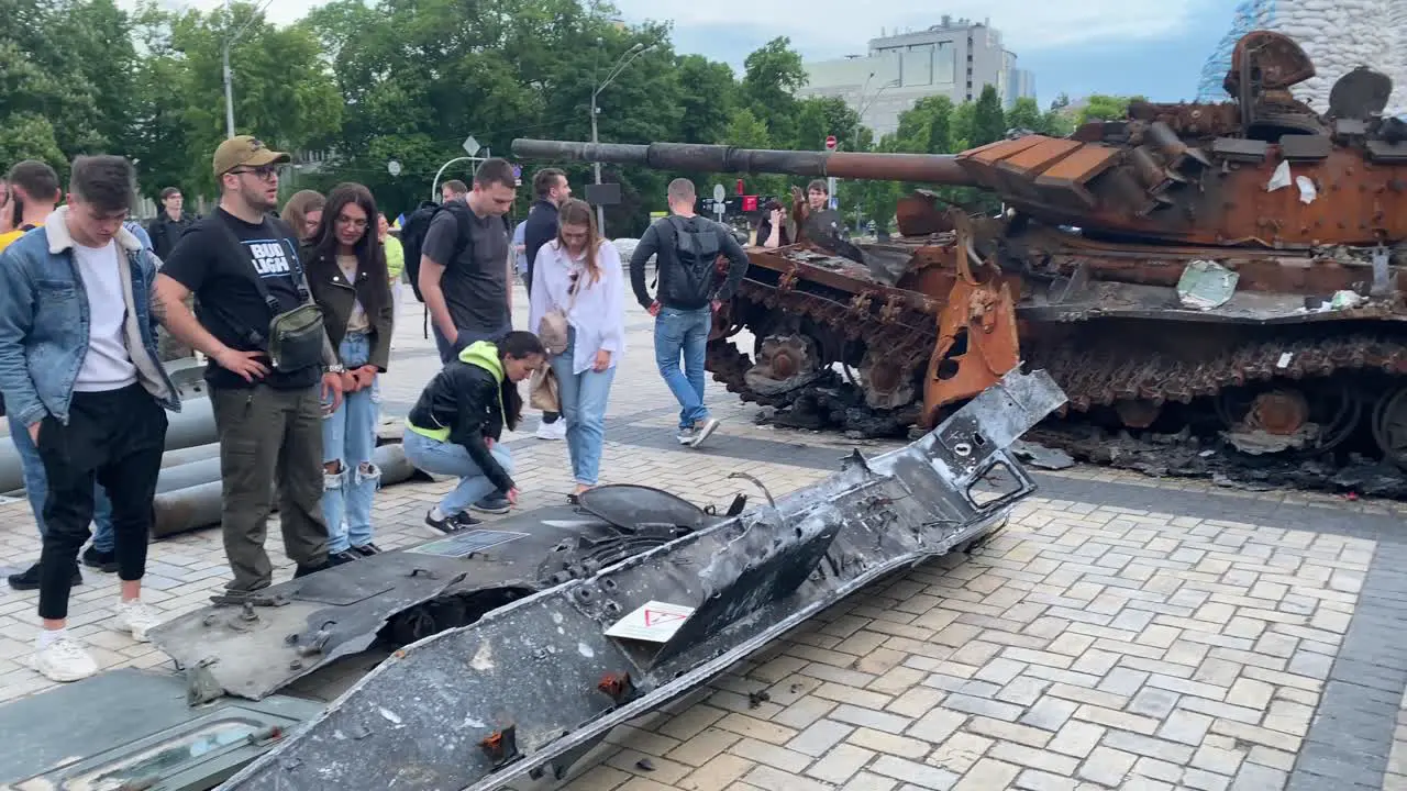 Tourists And Ukrainians Admire The Wreckage Of Captured Russian War Equipment On A Central Square In Downtown Kyiv Kiev Ukraine