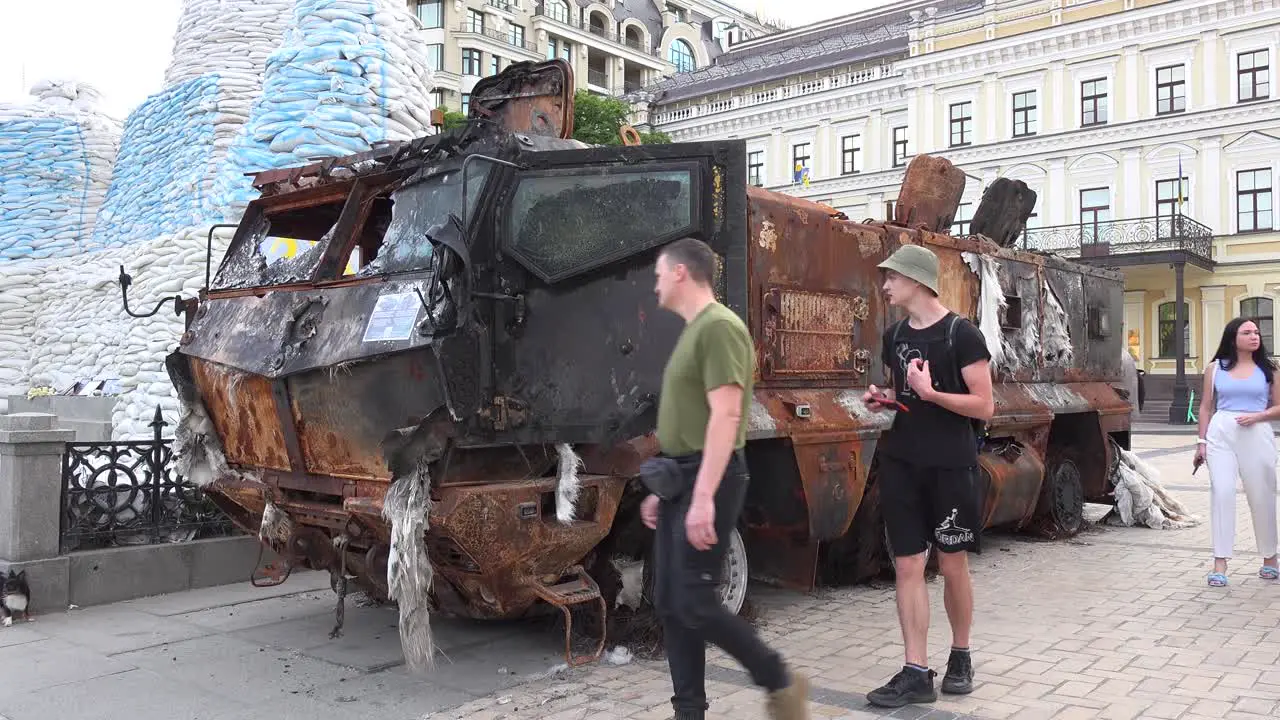 Tourists And Ukrainians Admire The Wreckage Of Captured Russian War Equipment On A Central Square In Dwontown Kyiv Kiev Ukraine