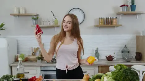 Girl recommending eating raw vegetable food Showing peppers in hands Weight loss and diet concept