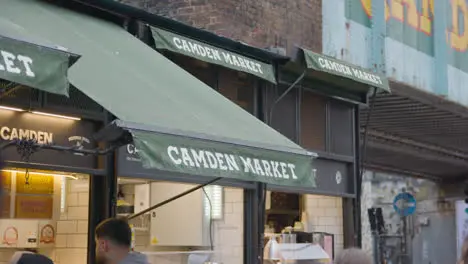 Close Up Of Food Stall Selling In Camden Lock Market In North London UK