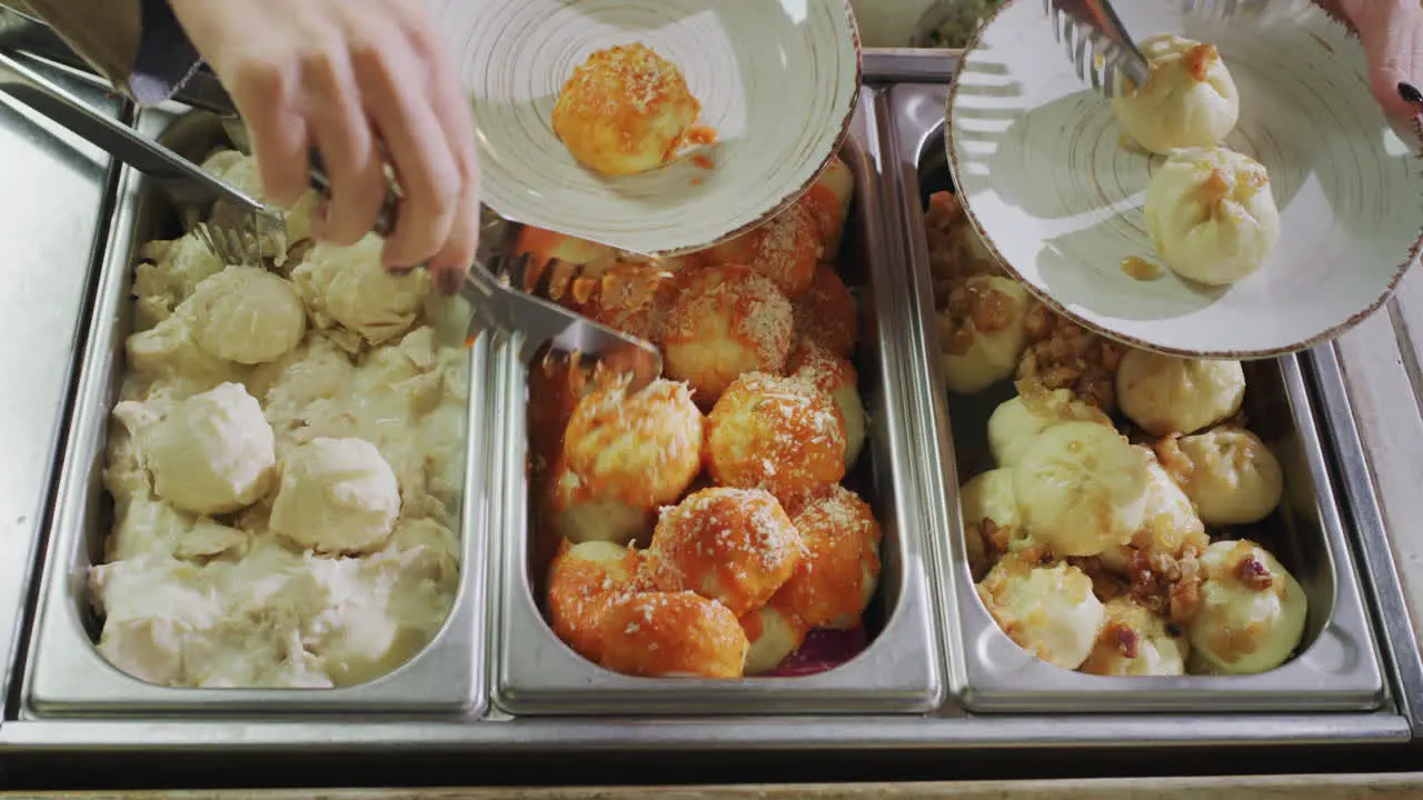 People put food on their plates Self service restaurant View from above