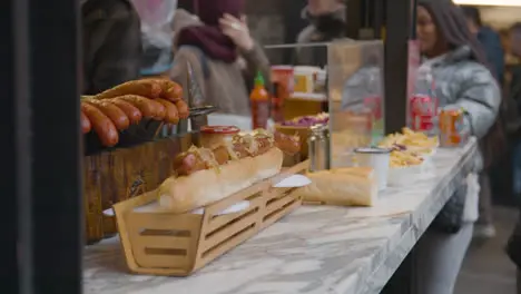 Close Up Of Food Stall Selling Hot Dogs In Camden Lock Market In North London UK