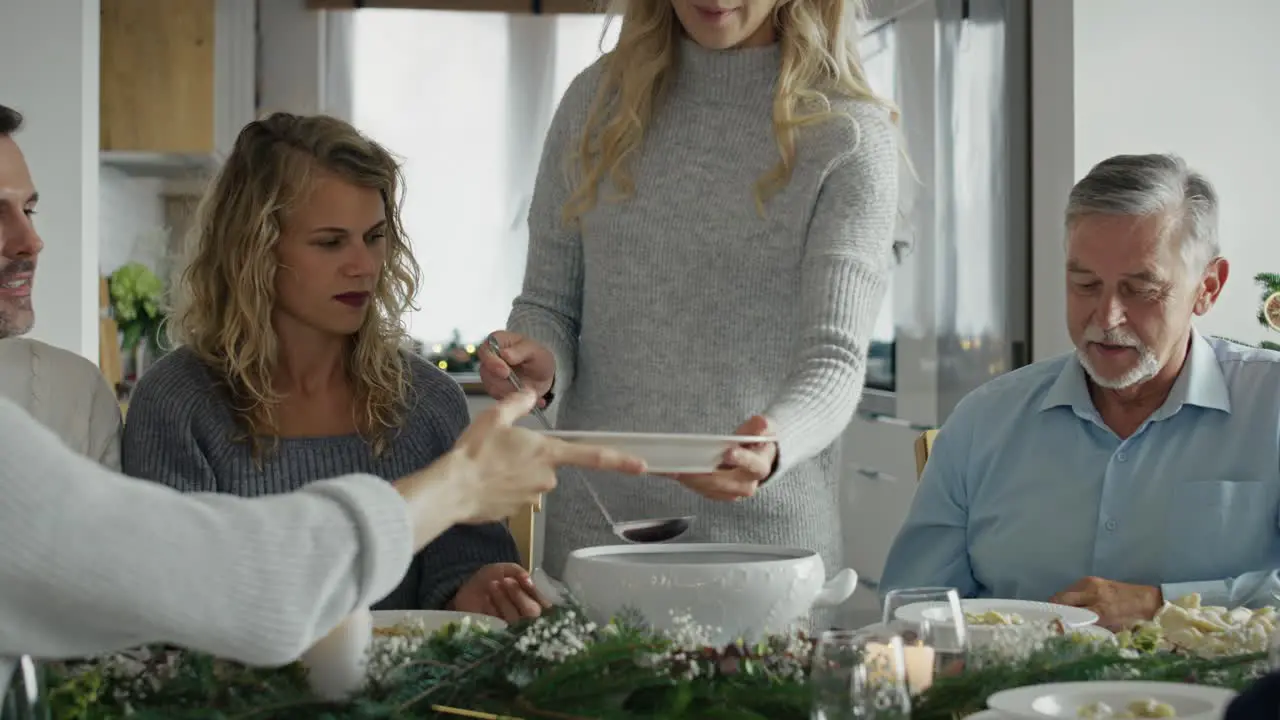 Caucasian family sharing the food in Christmas Eve