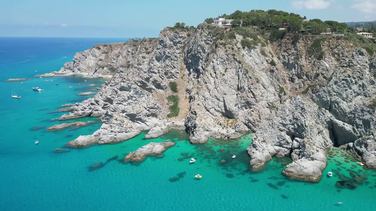 Capo Vaticano Cliff Lighthouse Blue Mediterranean Sea and Coastline of Calabria South Italy Aerial 4k Circling