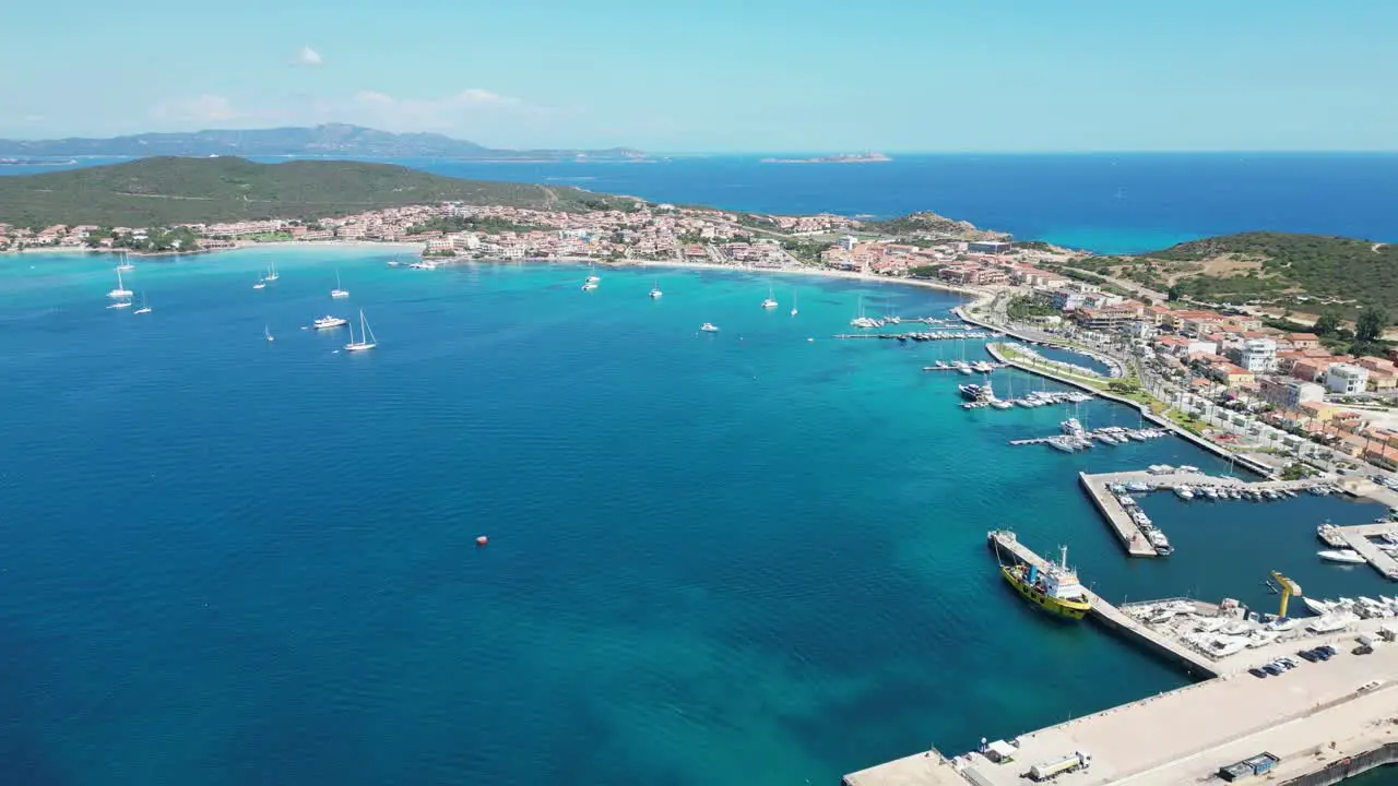 Golfo Aranci Port and coastal town in Sardinia Italy 4k Aerial Forward