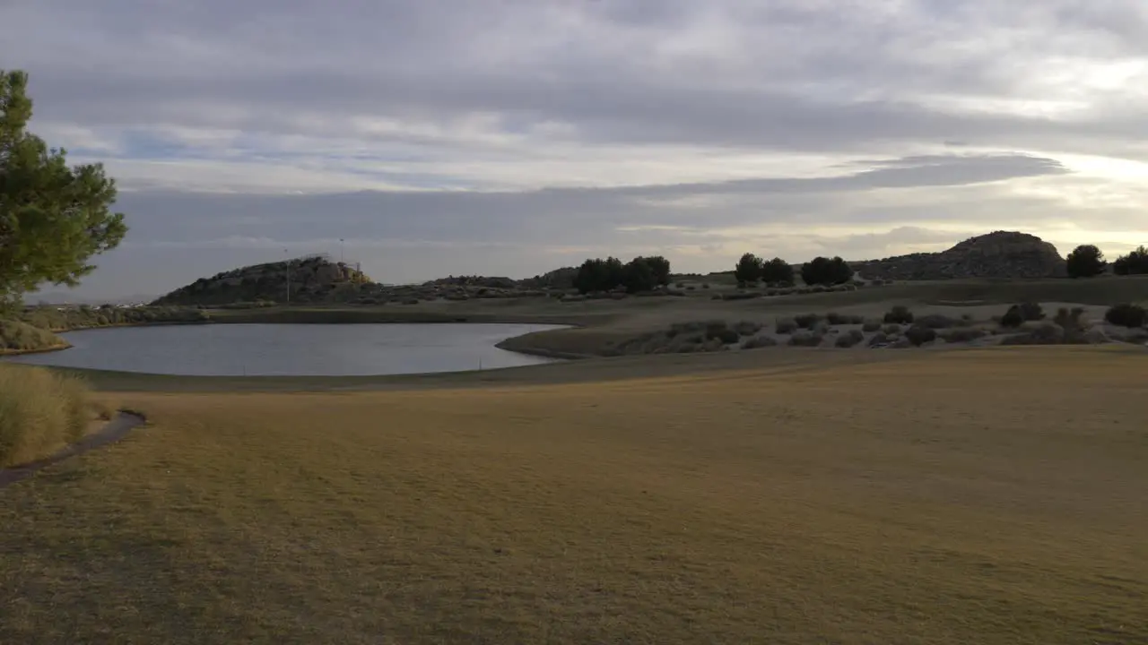 Lake on a golf course at sunset