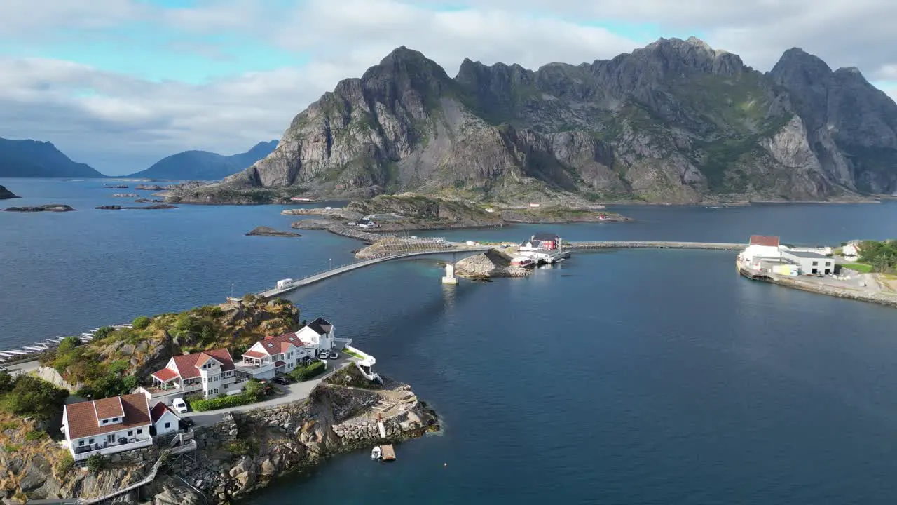 RV Camper drives bridge road to Henningsvaer at Lofoten Island Norway 4k Aerial