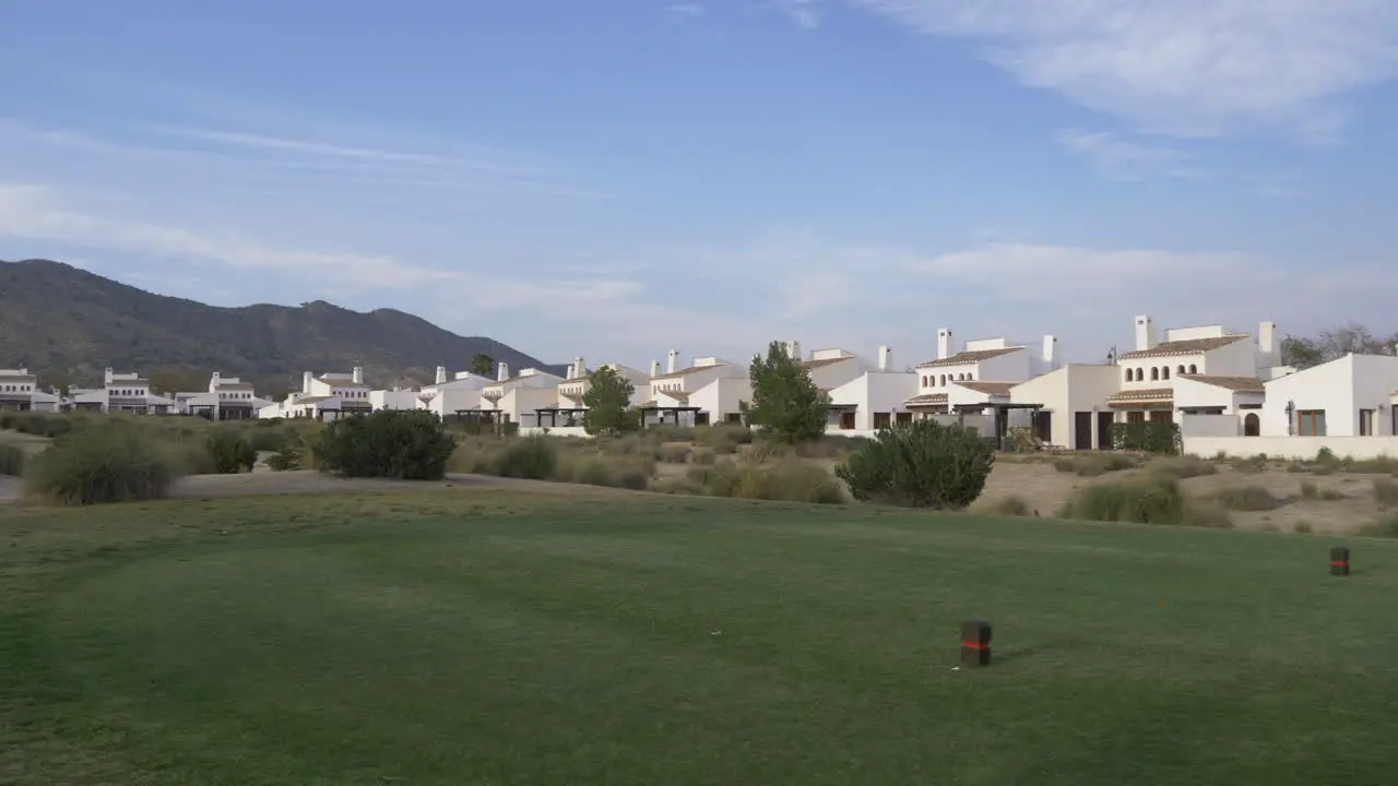 going passed a golf tee of a golf course in Spain