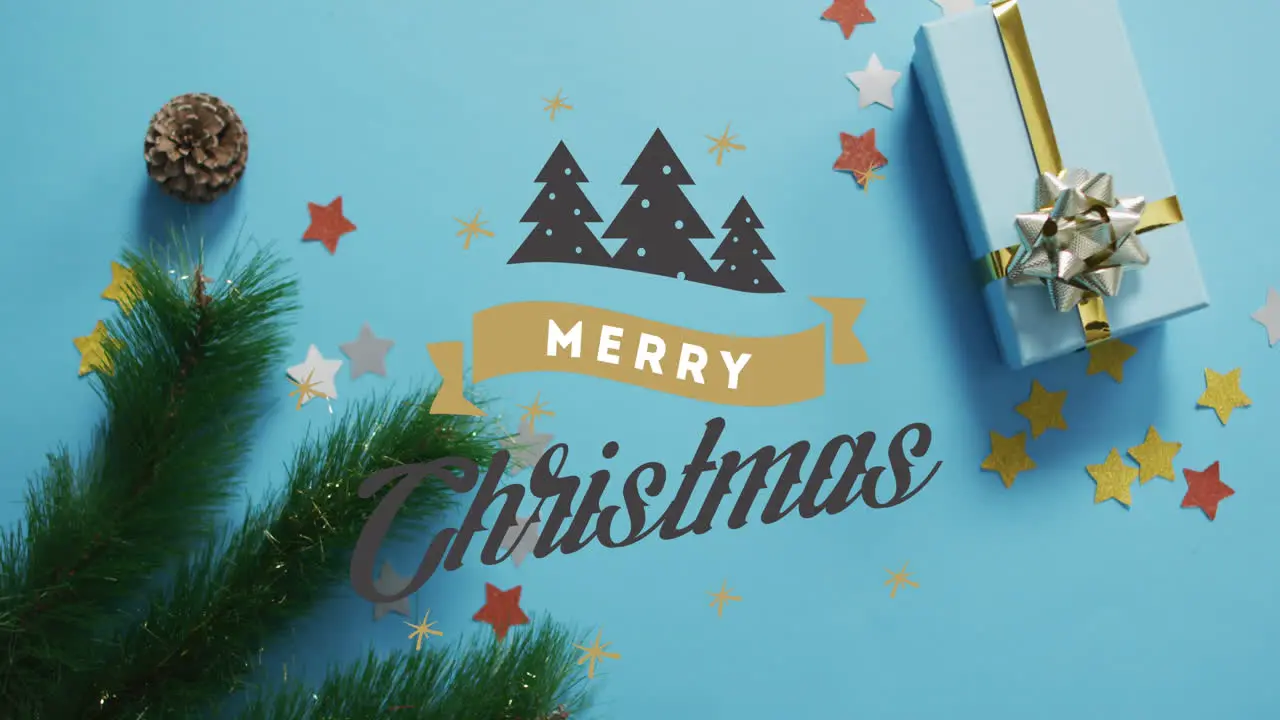 Animation of merry christmas text and christmas trees over decorations and gift box