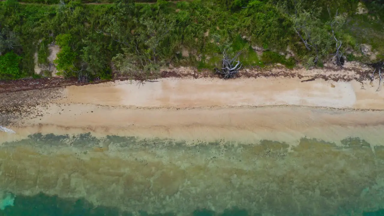 fly over a beach parallel to it giving a cinematic vibes to it