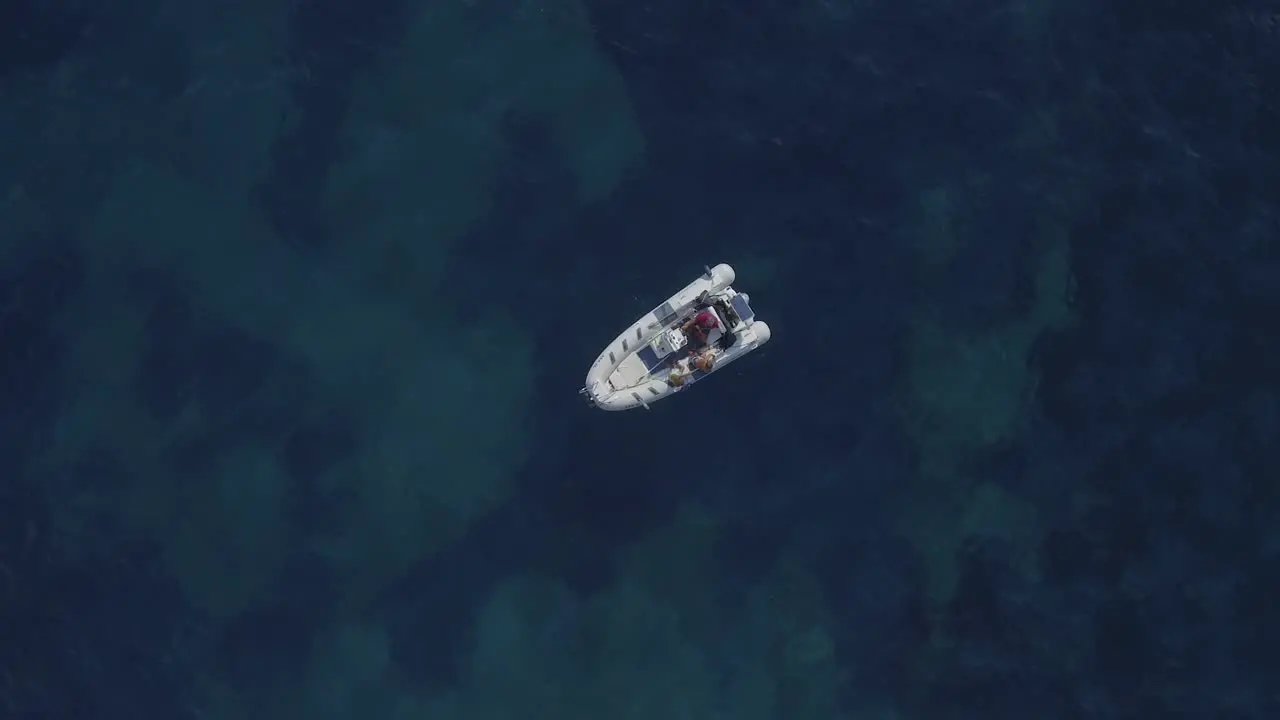 Speed boat static on dark blue sea background