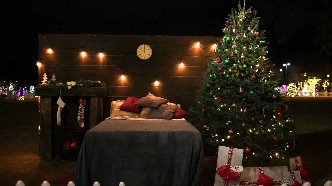 Christmas bedroom with tree lights and stockings outdoor at night