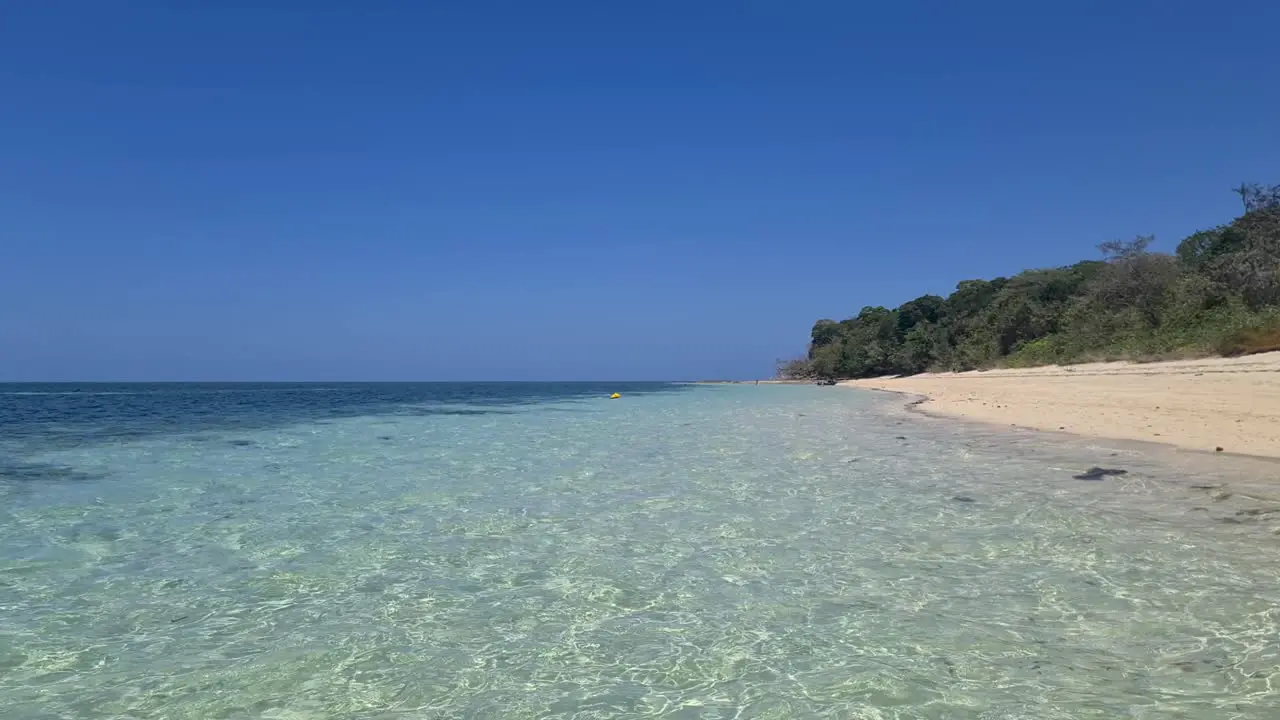 Aerial Low Flying Over Waters On Green Island Beach In Queensland