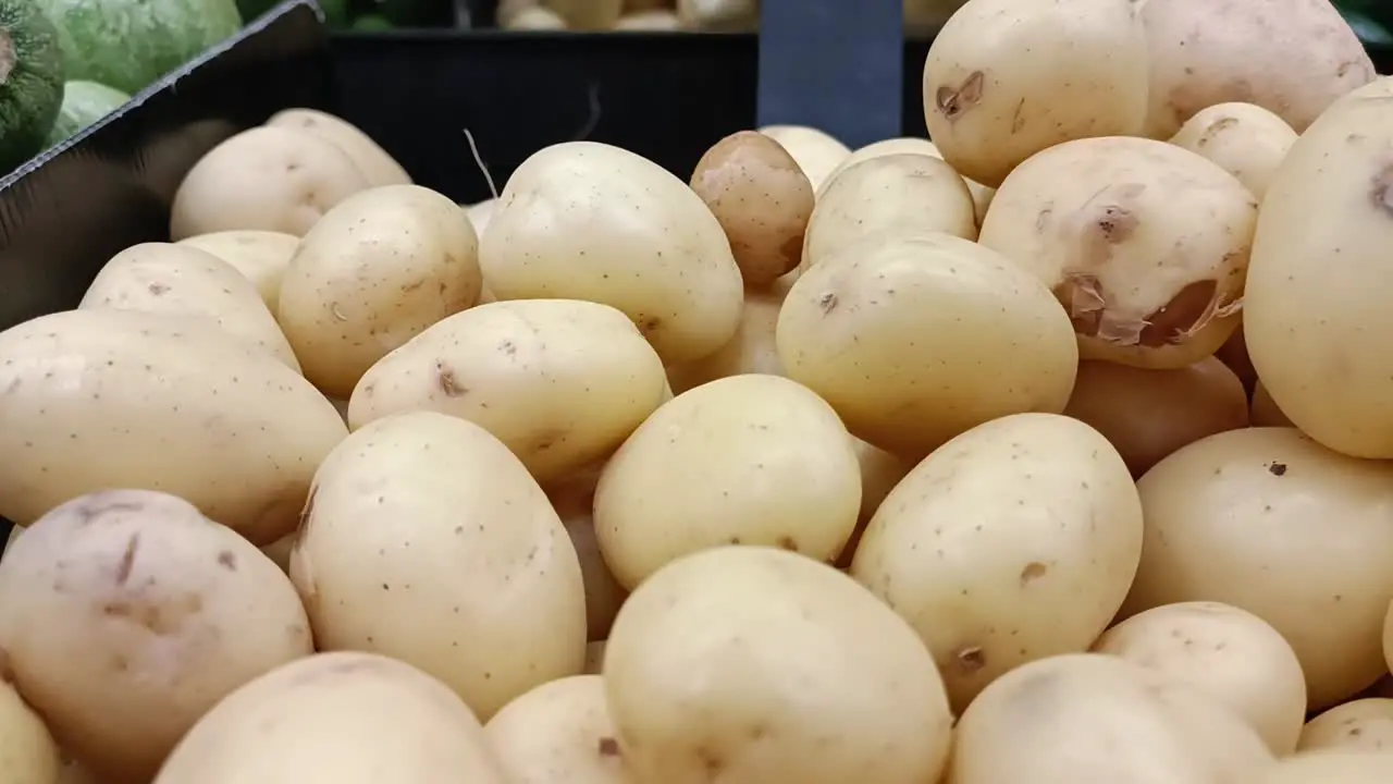 Close-up of fresh potatoes on a shelf in a supermarket