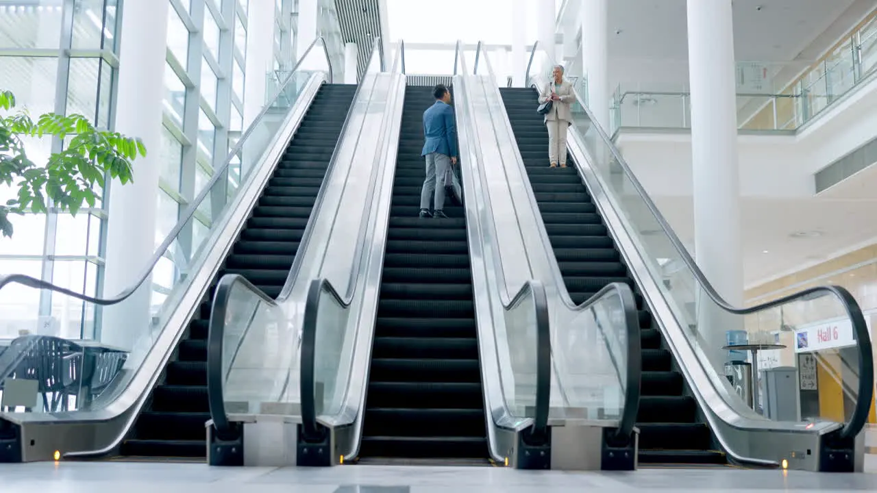 Escalator greeting and business people travel to