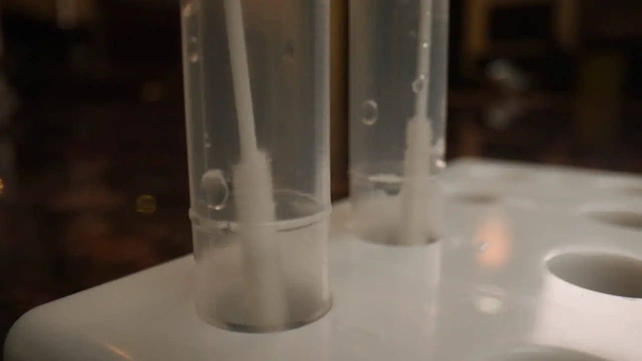 Close up COVID-19 coronavirus test swabs in tubes for at home rapid antigen testing